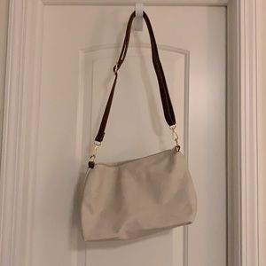 Cream faux leather handbag.